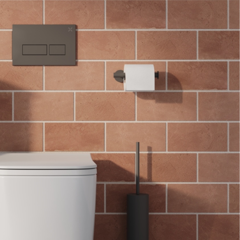 Product Lifestyle image of the Crosswater 3ONE6 Slate Toilet Roll Holder mounted above the 3ONE6 Slate Toilet Brush Holder